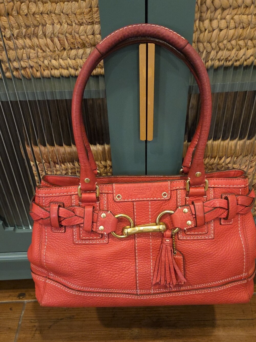 Coach Coral-Red Leather Shoulder Bag with Tassel and Gold Hardware